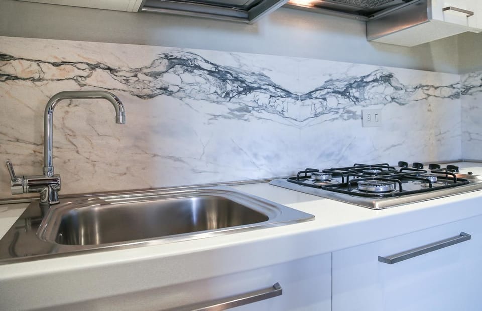 Apartment, 2 Bedrooms | Private kitchen | Full-size fridge, stovetop, cookware/dishes/utensils