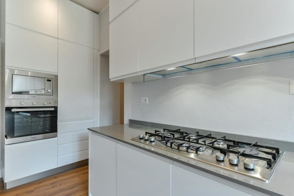 Apartment, 4 Bedrooms | Private kitchen | Full-size fridge, microwave, oven, stovetop