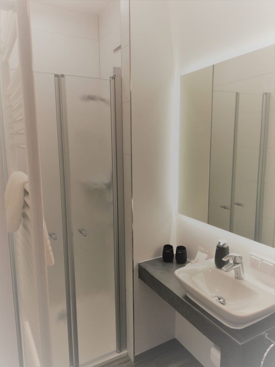 Shower, free toiletries, hair dryer, slippers