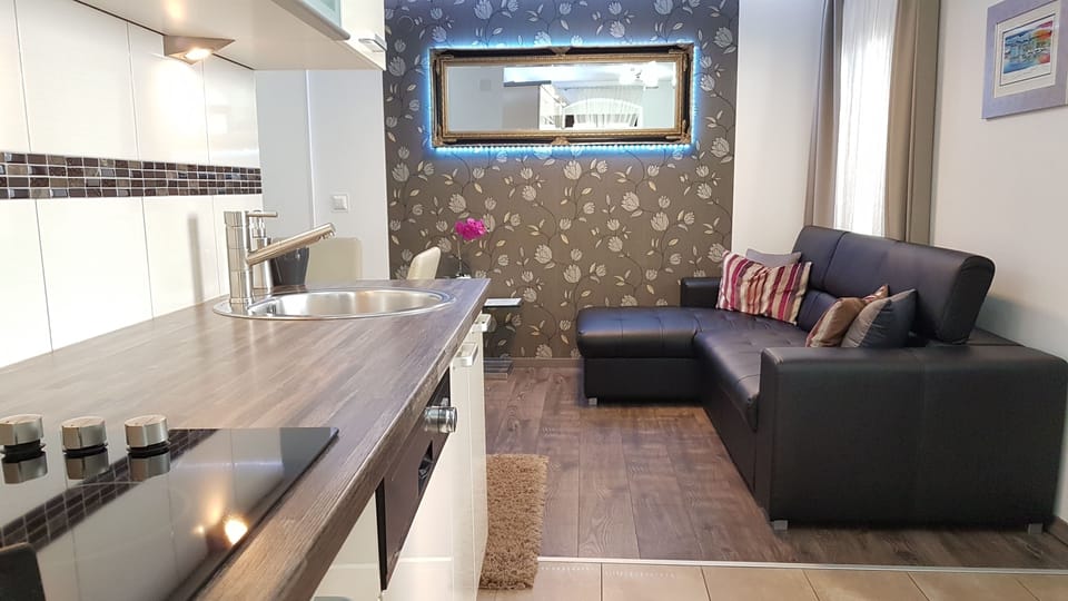 Comfort Apartment, 1 Bedroom | Living area | Flat-screen TV