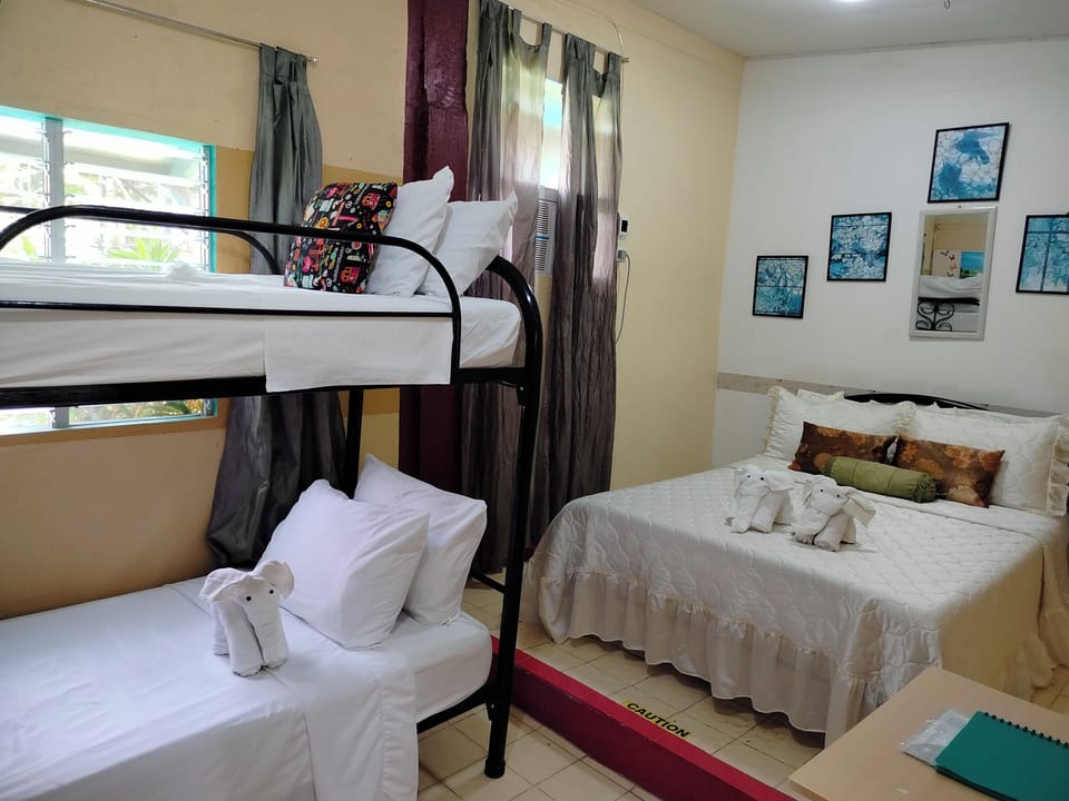 Family Quadruple Room, Multiple Beds | Premium bedding, individually decorated, individually furnished