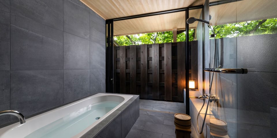 Luxury Suite 101 | Bathroom | Separate tub and shower, deep soaking tub, rainfall showerhead