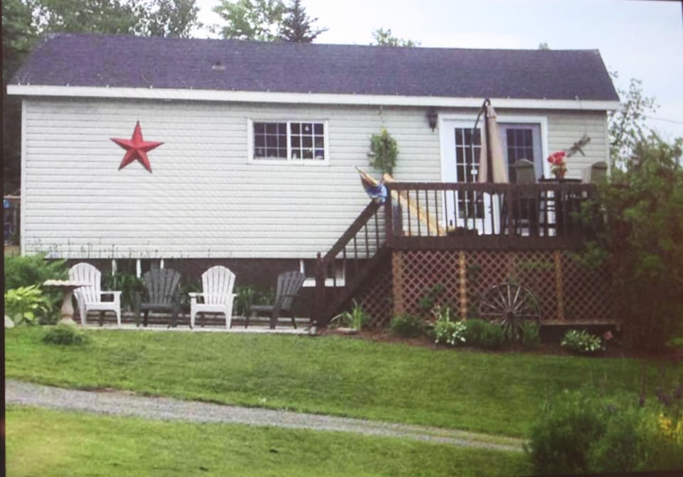 side of cottage and deck