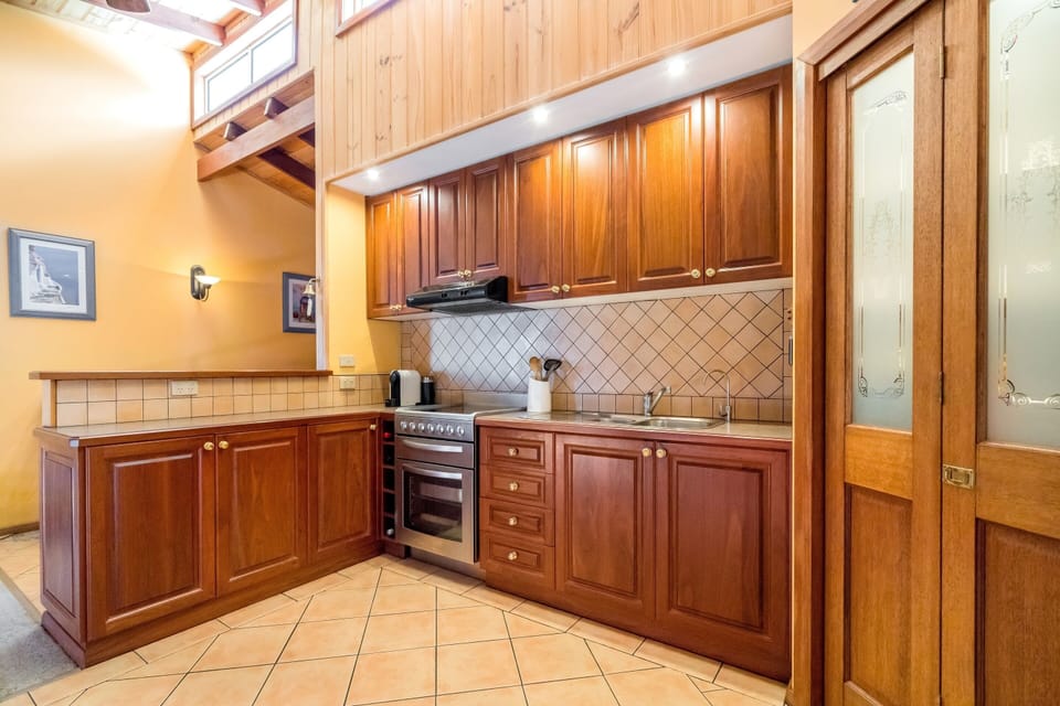 Deluxe 4 Bedroom House with Tri-Bunk Bed and Beach Views | Private kitchen | Full-size fridge, microwave, oven, stovetop