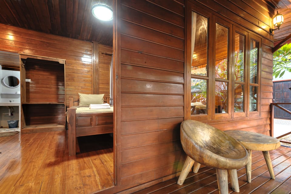 Standard Triple Room | Living area | Flat-screen TV
