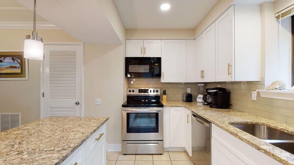 Kitchen with Custom Cabinetry and Stainless Steel Appliances