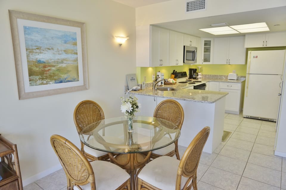 Dining Area with Glass topped Table and 4 Chairs