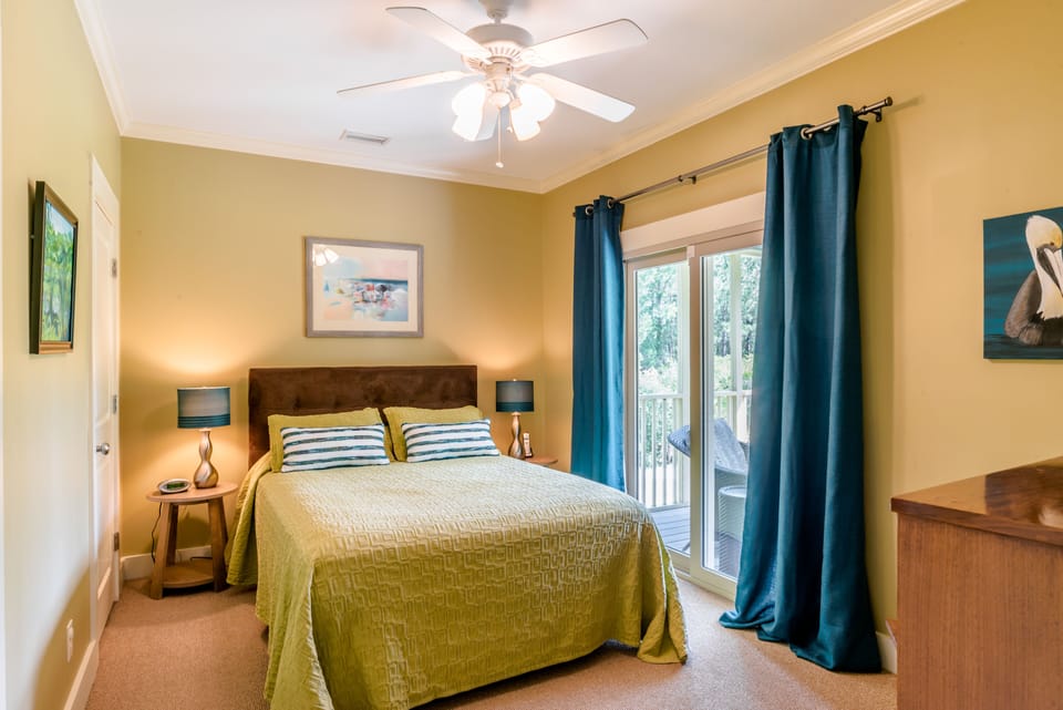 Downstairs queen bedroom has access to the main bath and back porch.