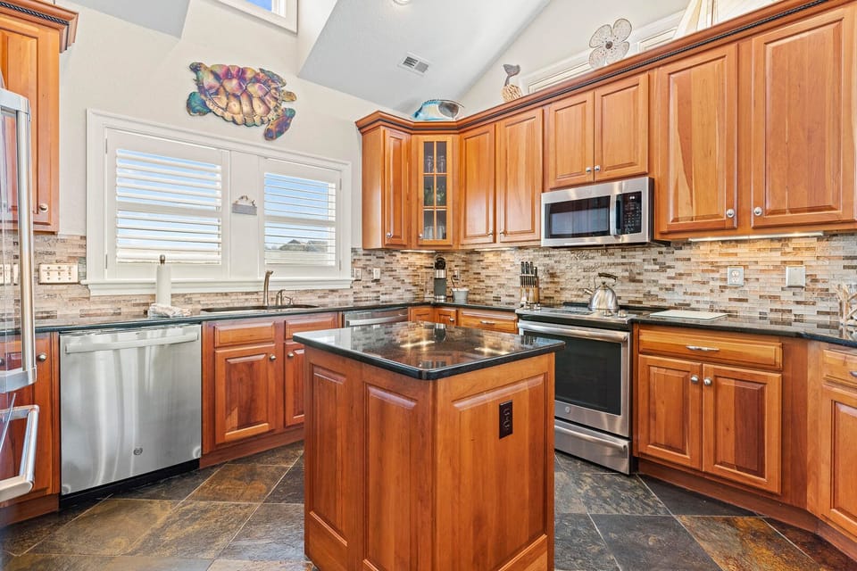 Large Kitchen with Bar Seating on Third Level