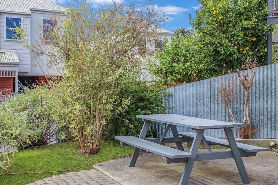Shared outdoor seating area for guests to relax and enjoy the fresh air.