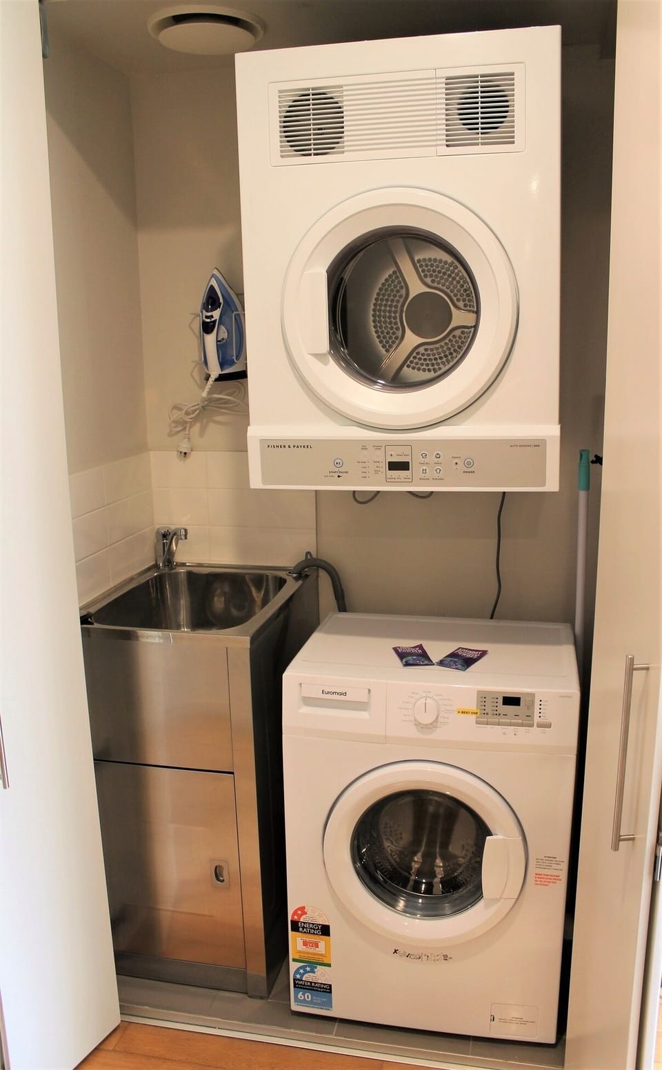 Laundry with washing machine, dryer, iron and ironing board