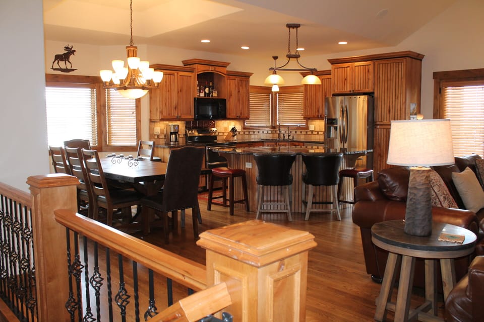 Dining and kitchen view from front door entry