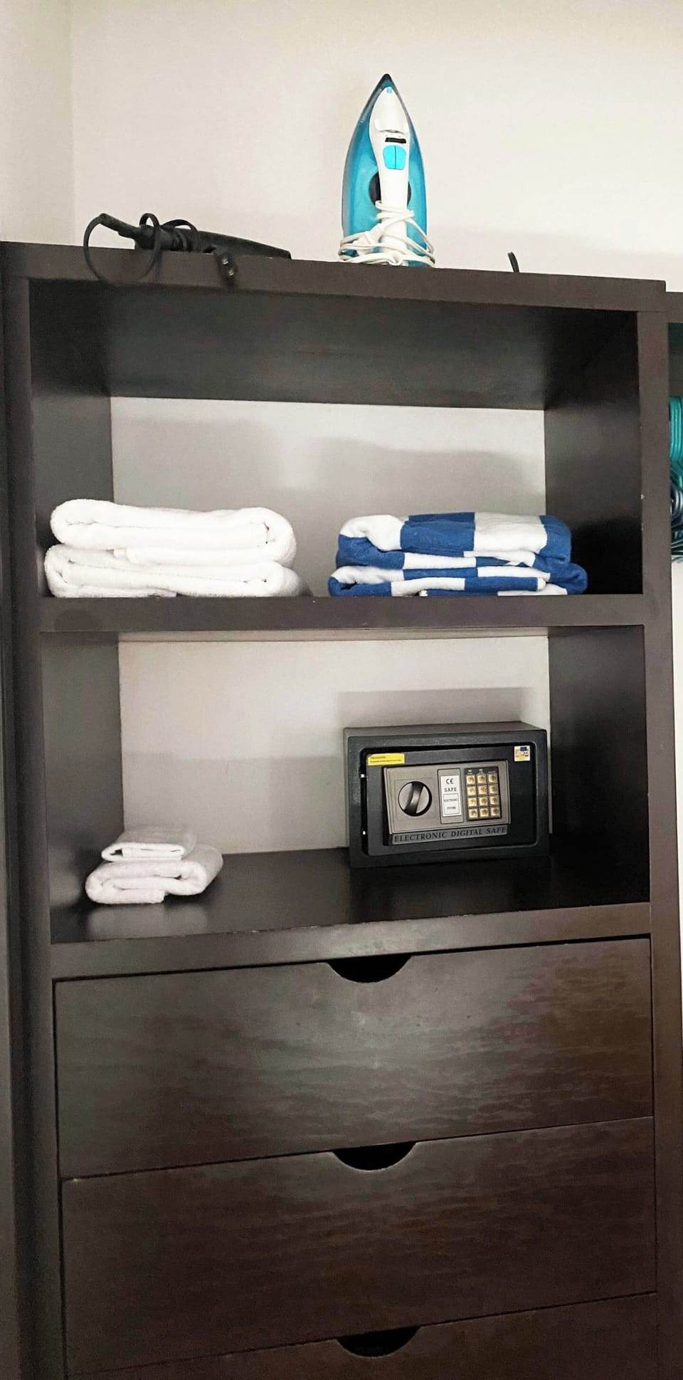 Closet with security box, hair dryer, iron and beach and bath towels