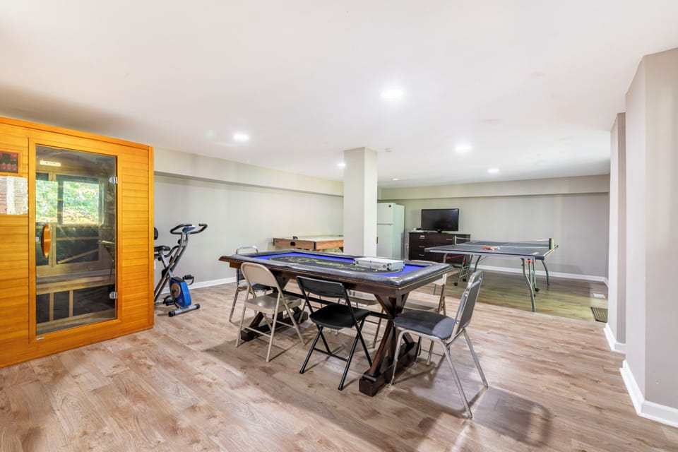 Lower level w poker table, ping pong, and sauna. Spare refrigerator.