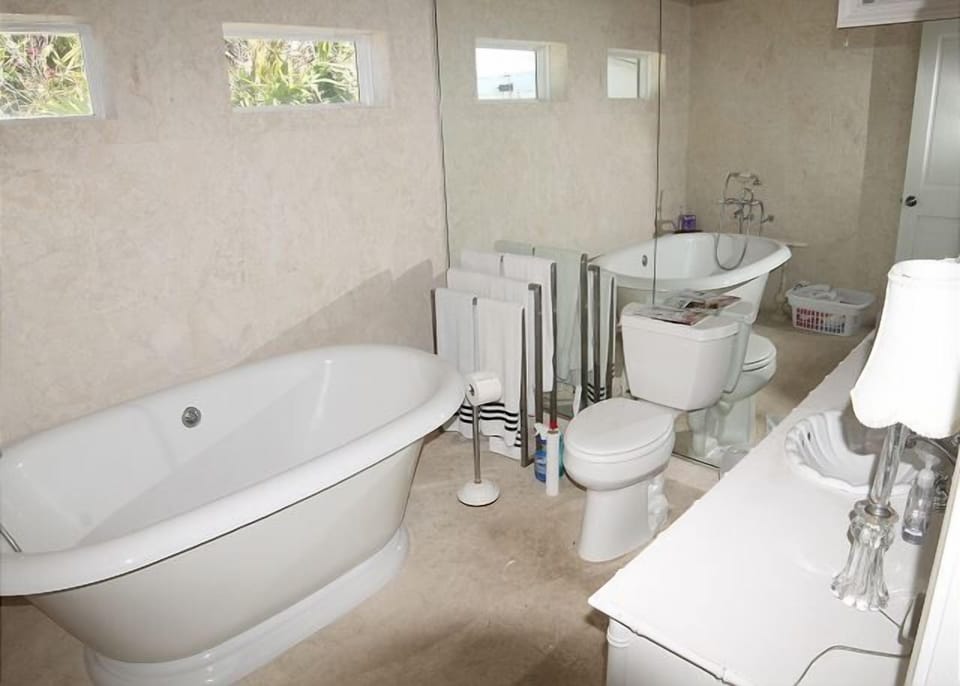 Elegant bathroom with a freestanding tub and modern amenities.