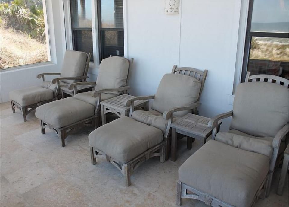 Balcony with comfortable lounging chairs, perfect for relaxing.