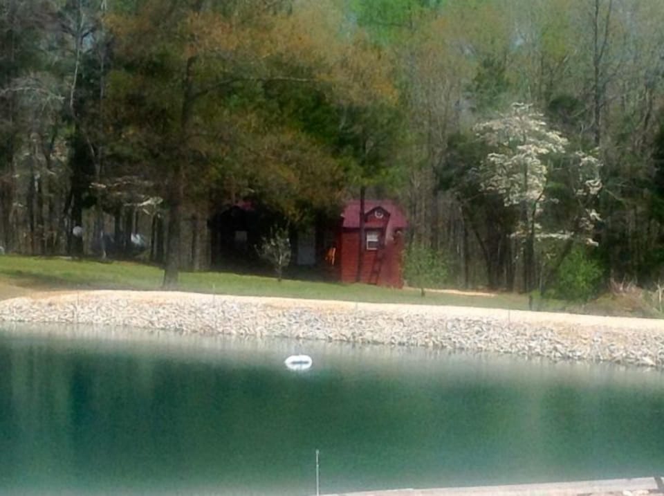 OUTSIDE FRONT CABIN 2 SHOWING POND