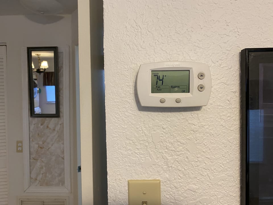 central air and heat, ceiling fan with light in living area