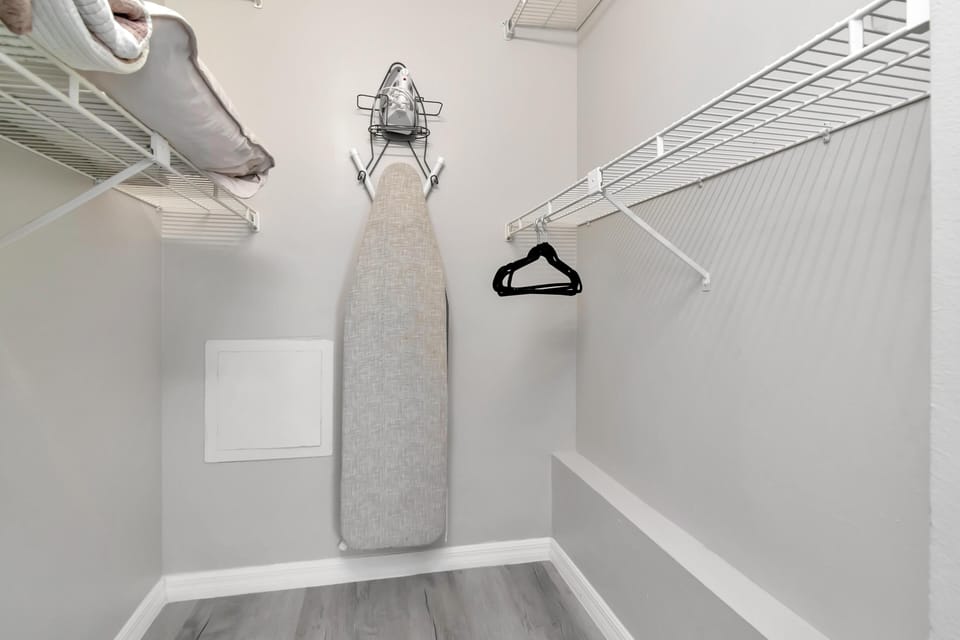 Spacious walk-in closet with organized shelving and hanging space