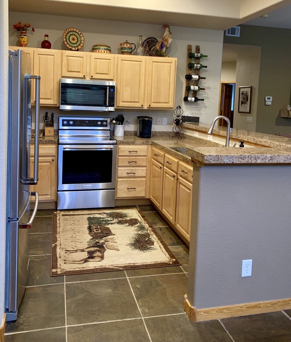 Updated kitchen with stainless steel appliances and accessories.  