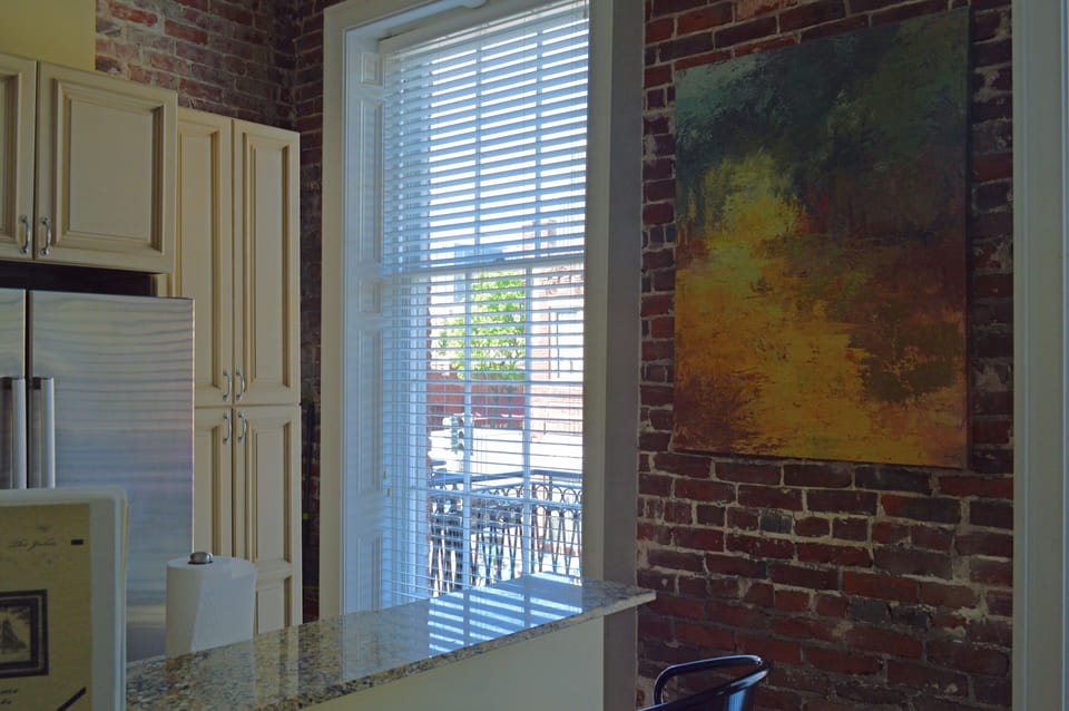 Original exposed brick walls, floor to ceiling windows