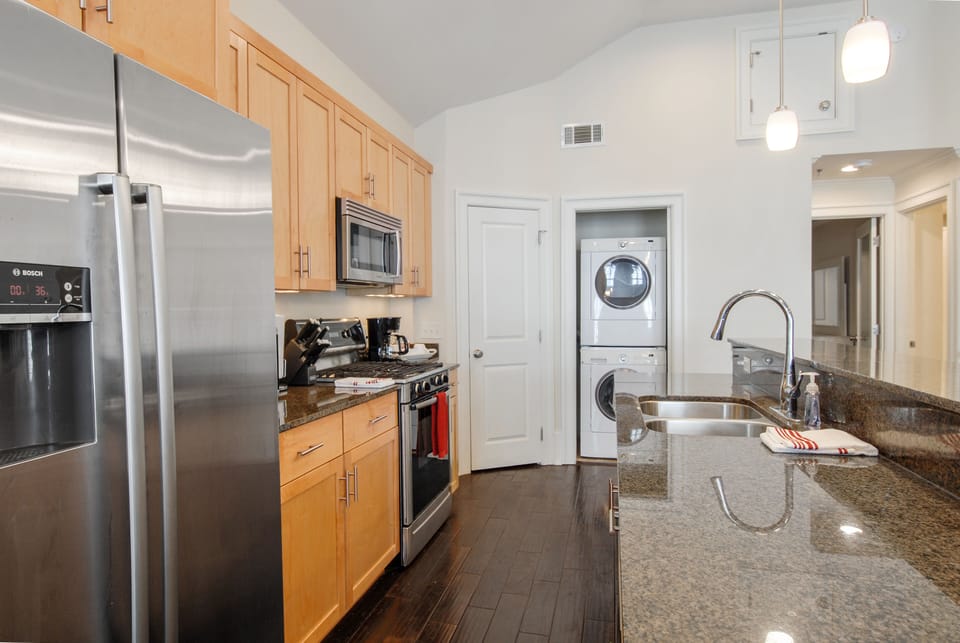 Kitchen with accessible Stacked Washer/Dryer unit