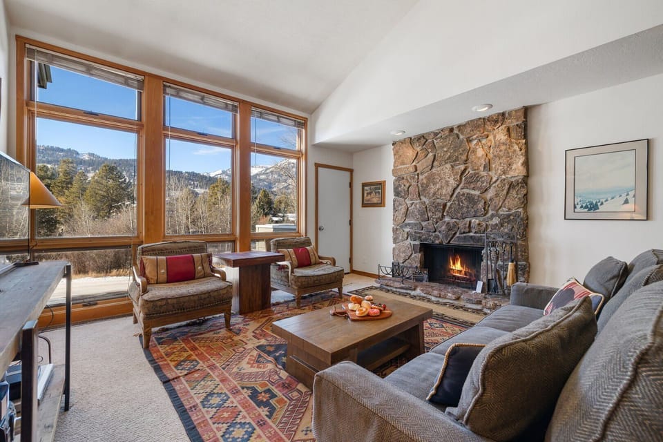 Living Room w/ Fireplace and Deck