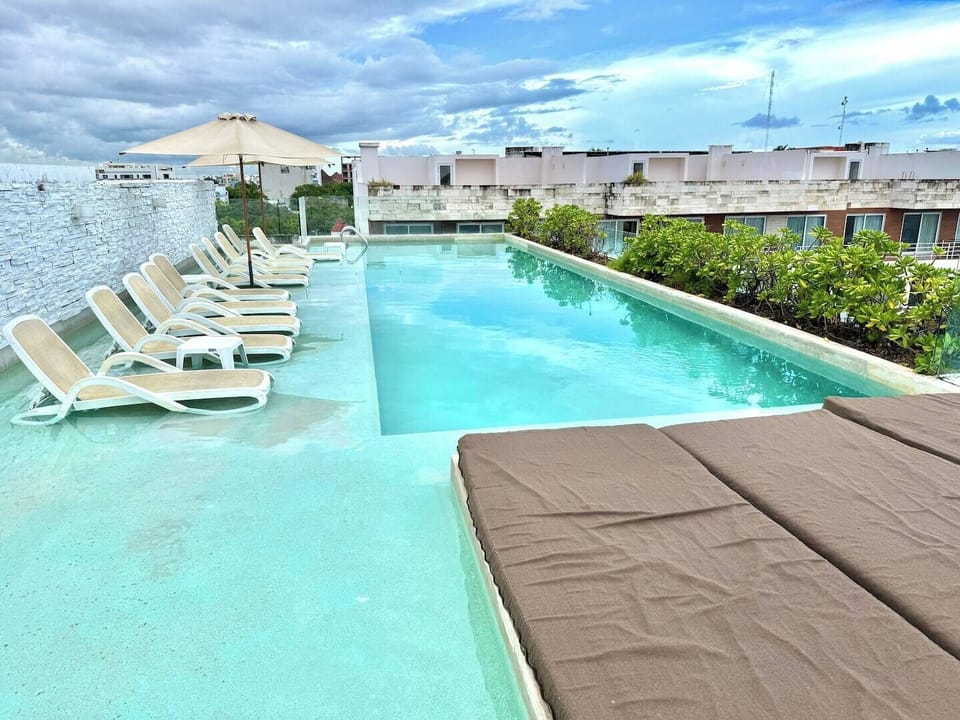 Shared rooftop pool with city views