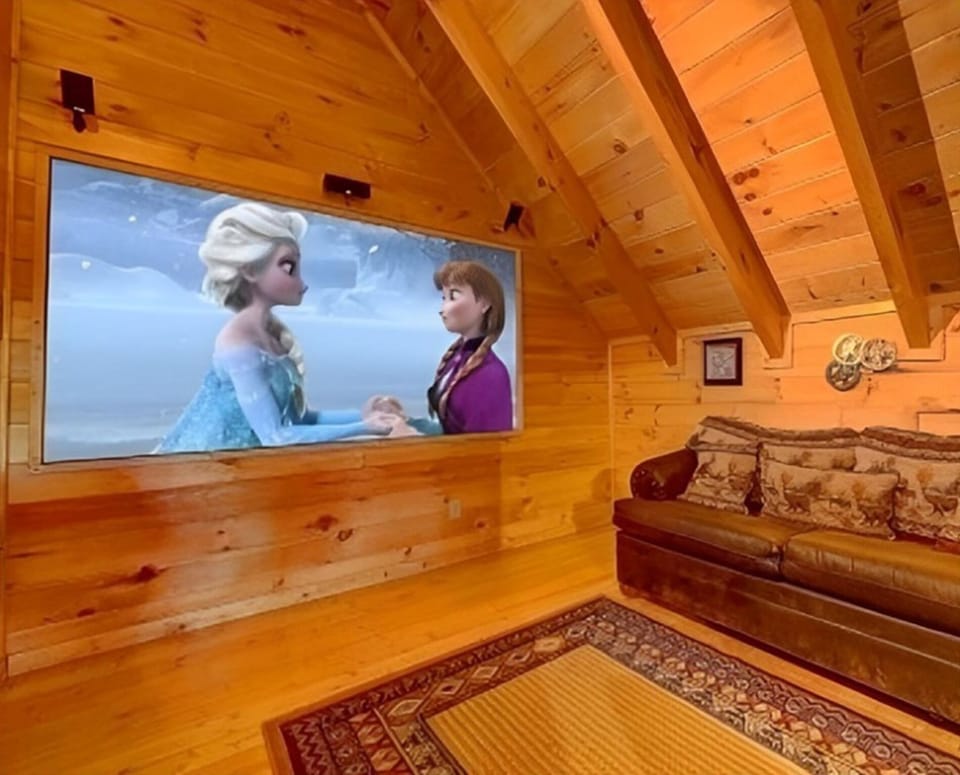 Enjoy movie nights in the theater room, which also features a cozy queen sofa sleeper for added sleeping space