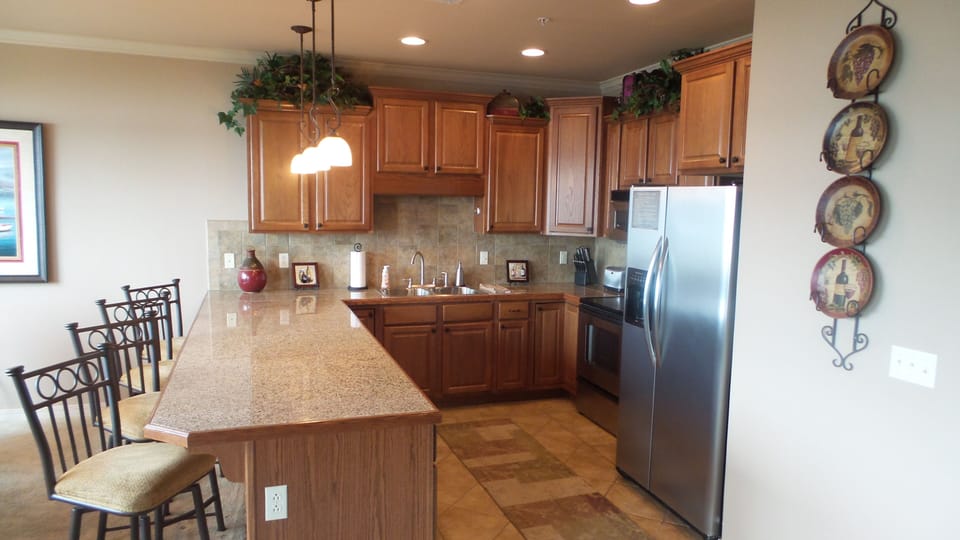 Well stocked kitchen will make you feel right at home. New range and dishwasher