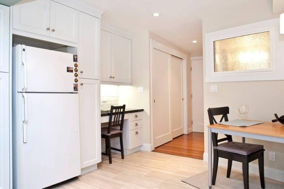 High-end hot dual plate and convection oven, custom cabinets, granite counter top, dishwasher, and Keurig coffee machine with free coffee.