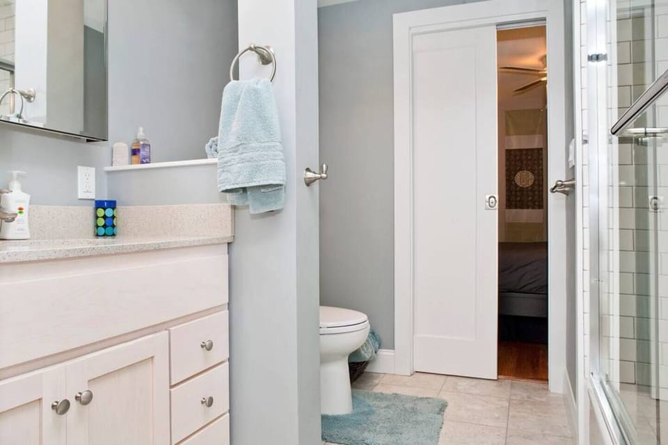 Full bathroom, including soap, shampoo, conditioner, hair dryer, misc toiletries