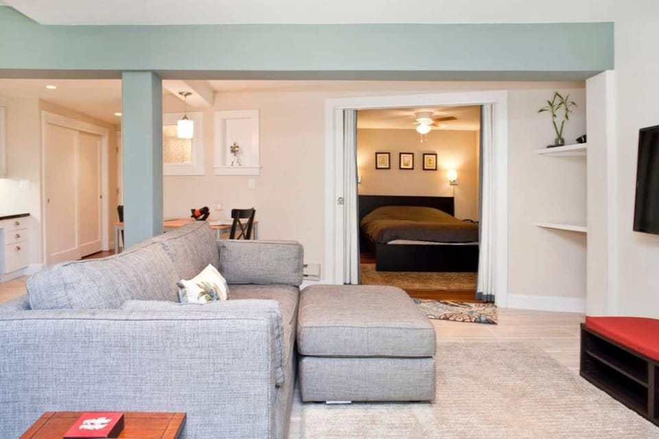 Living room area with a view of the bedroom.