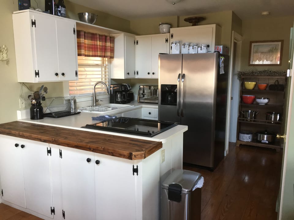 Kitchen fully stocked with lots of extras. Coffee maker, crock pot, rice cooker.