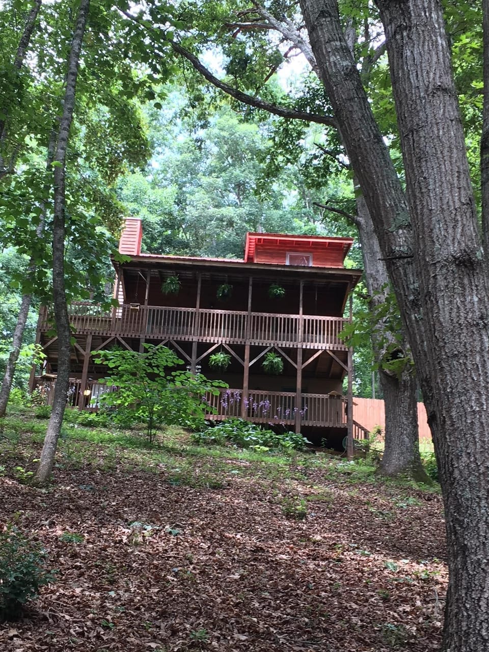 Cabin Front View. Double decks and beautiful trees and landscaping.