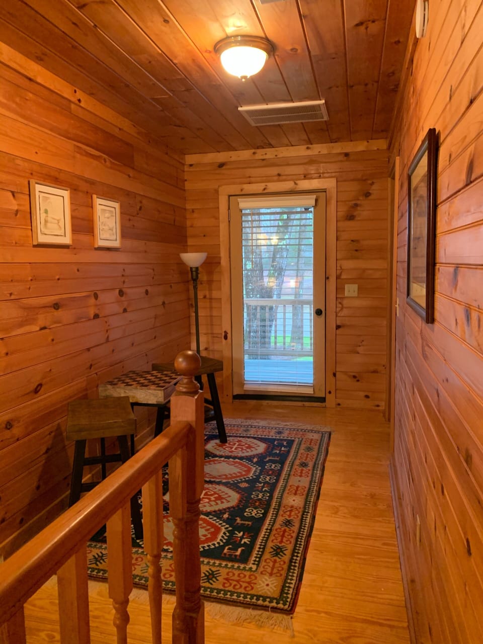 Second floor hall and balcony serves as entrance to two bedrooms.  