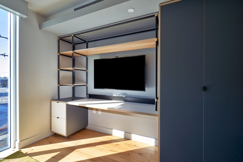 Premier Suite (Full Bed) | Living area | 50-inch Smart TV with satellite channels, TV