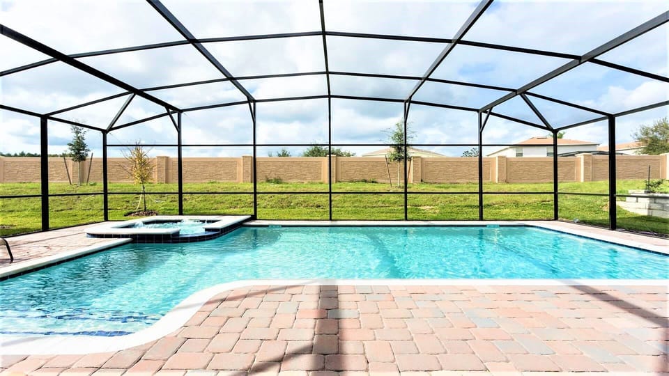 Exclusive use of a screened-in spa and pool ensures a private and serene aquatic retreat just for you
