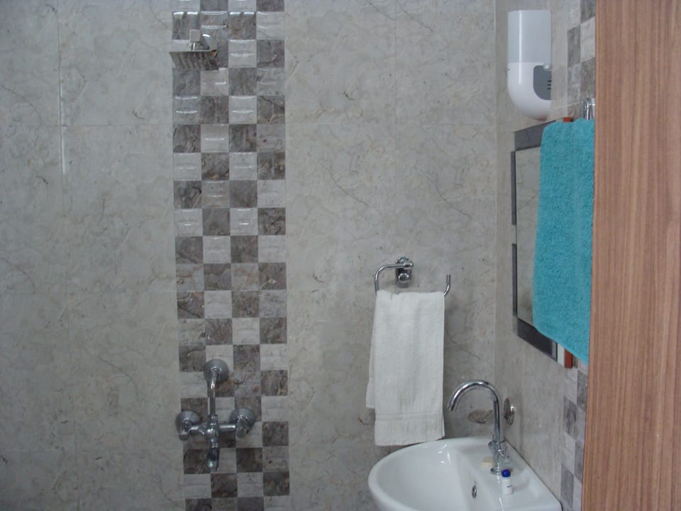 Economy Room (Non AC) | Bathroom | Shower, towels
