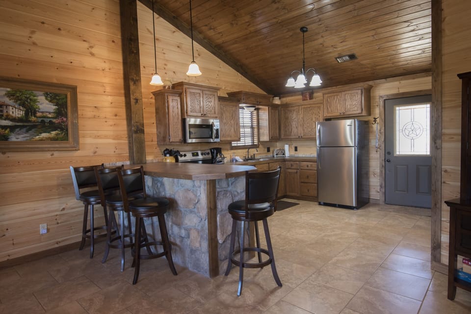 Kitchen-Refrigerator-Cabinets-Stove-Vessels-Faucet-Table-Bar Stools