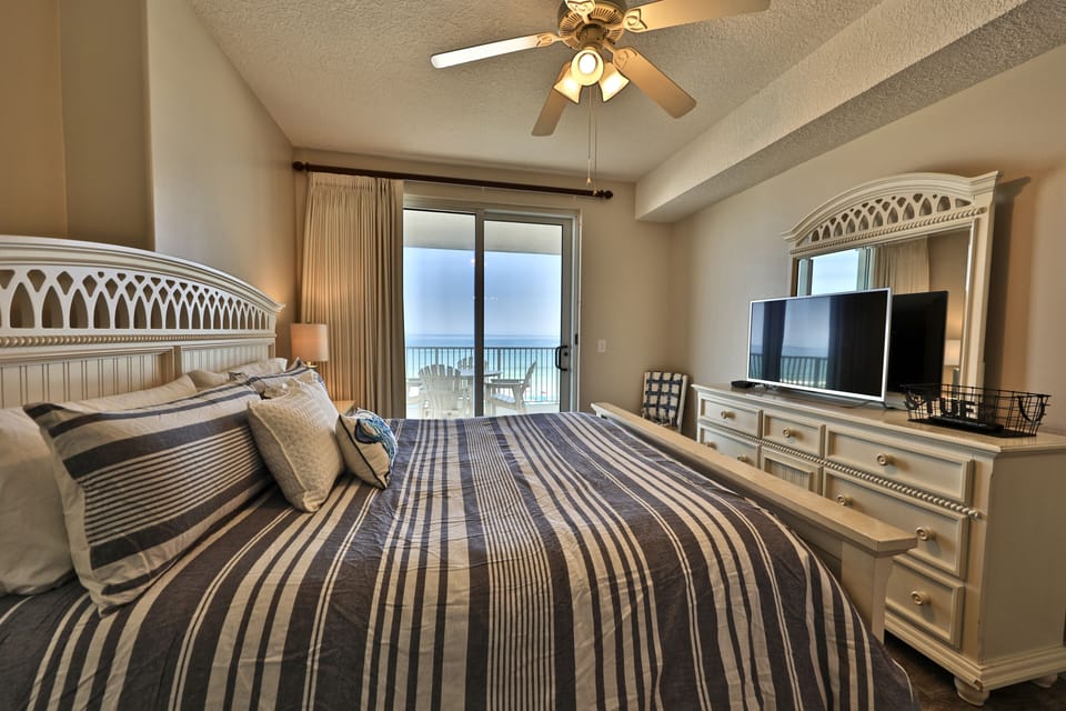 Large flat-screen TV in the master bedroom.