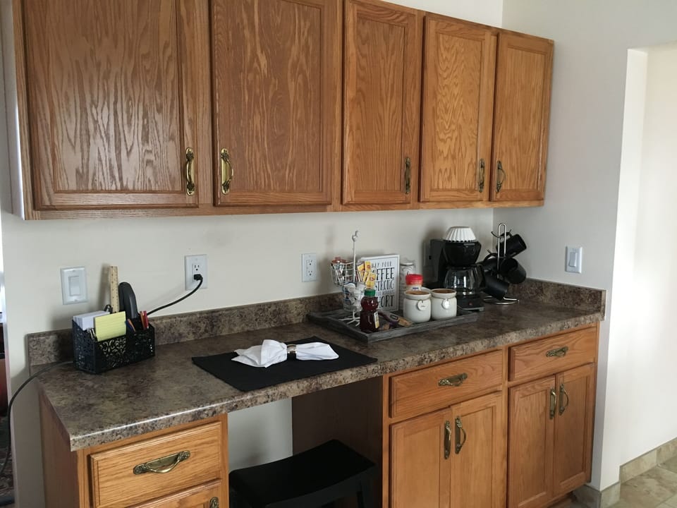 Complimentary coffee and condiments for your stay. Nice desk area. 