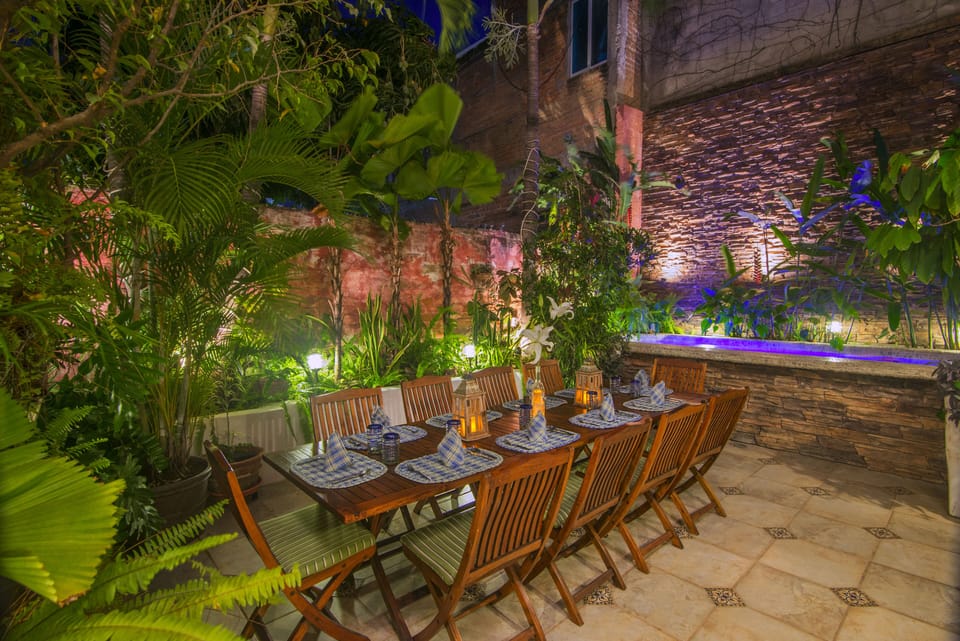 PATIO INTERIOR  off kitchen/living room  Pool in background, very romantic.