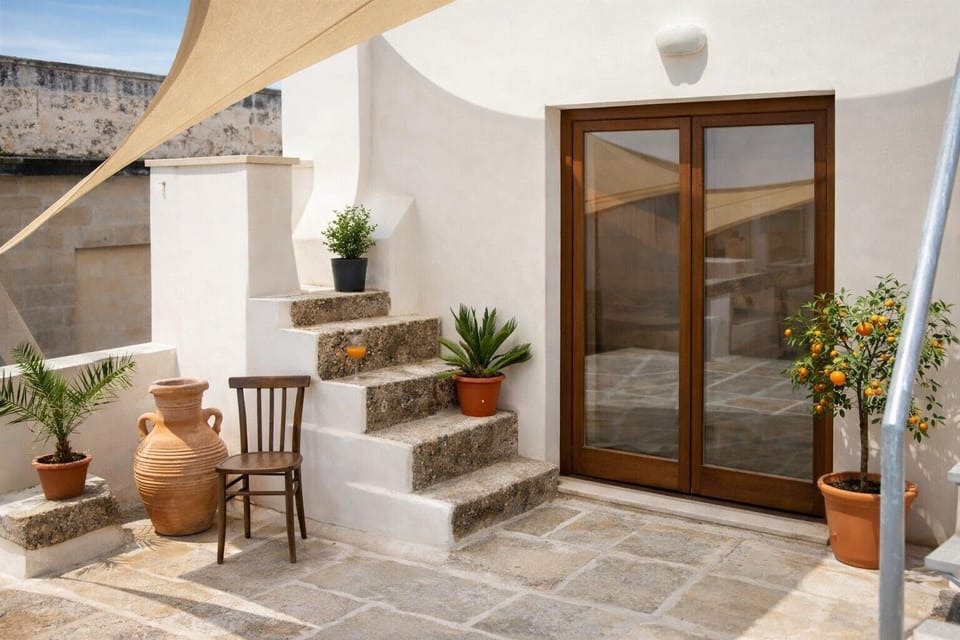 Our private roof terrace with shade, character and french doors to the kitchen