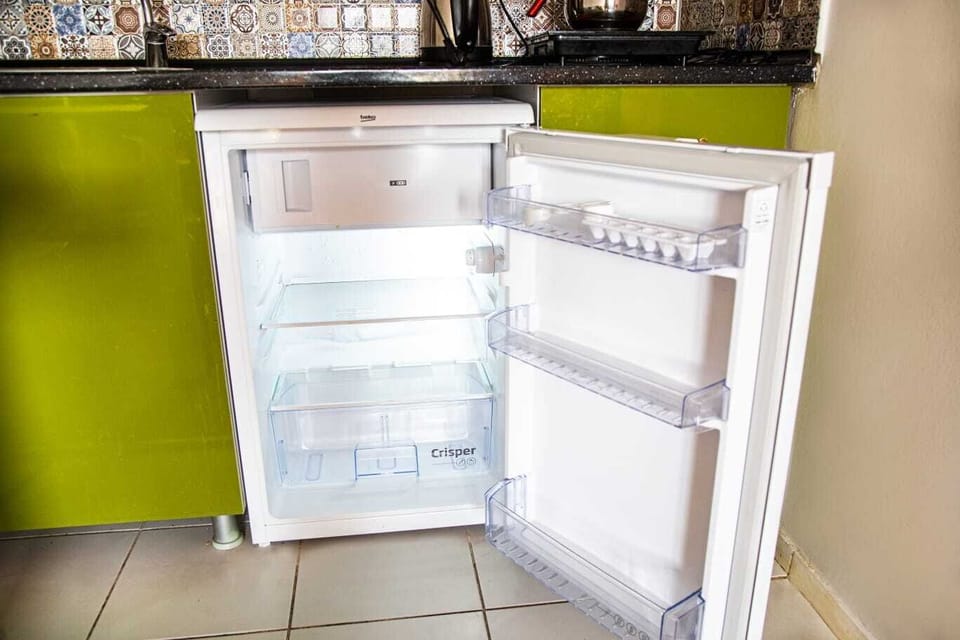 Fridge, stovetop, electric kettle, cookware/dishes/utensils