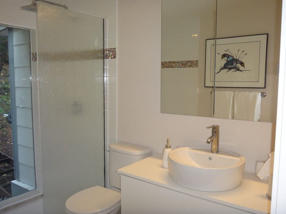 Luxury spa bathroom with heated tiles and rainshower