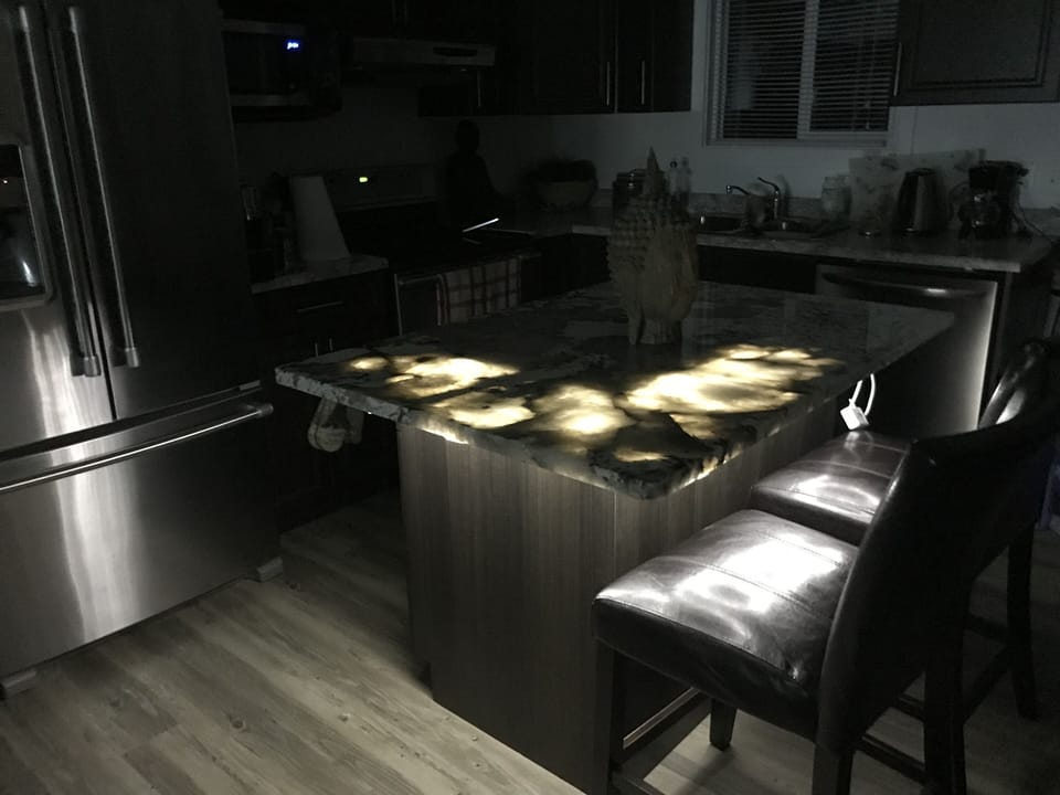 Island counter is a see through granite... very cool lit up!