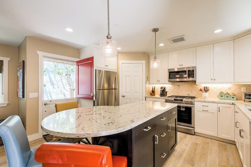 Great kitchen with beautiful quartz countertops and a walk-in pantry. 