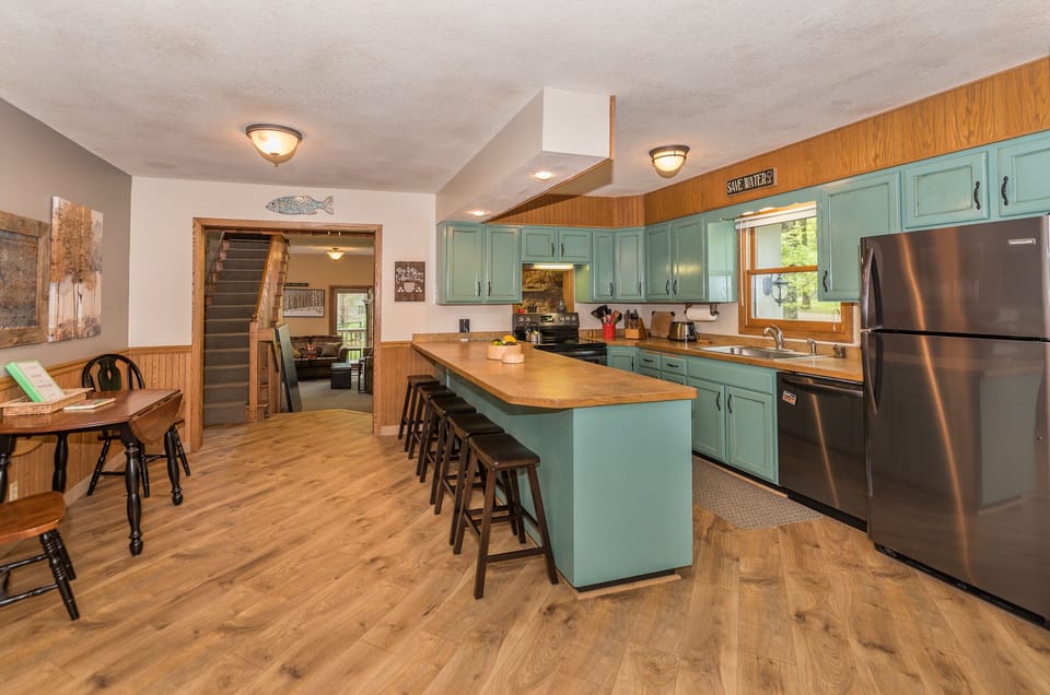 Open kitchen overlooking pool table, so the chef is included in all the fun!