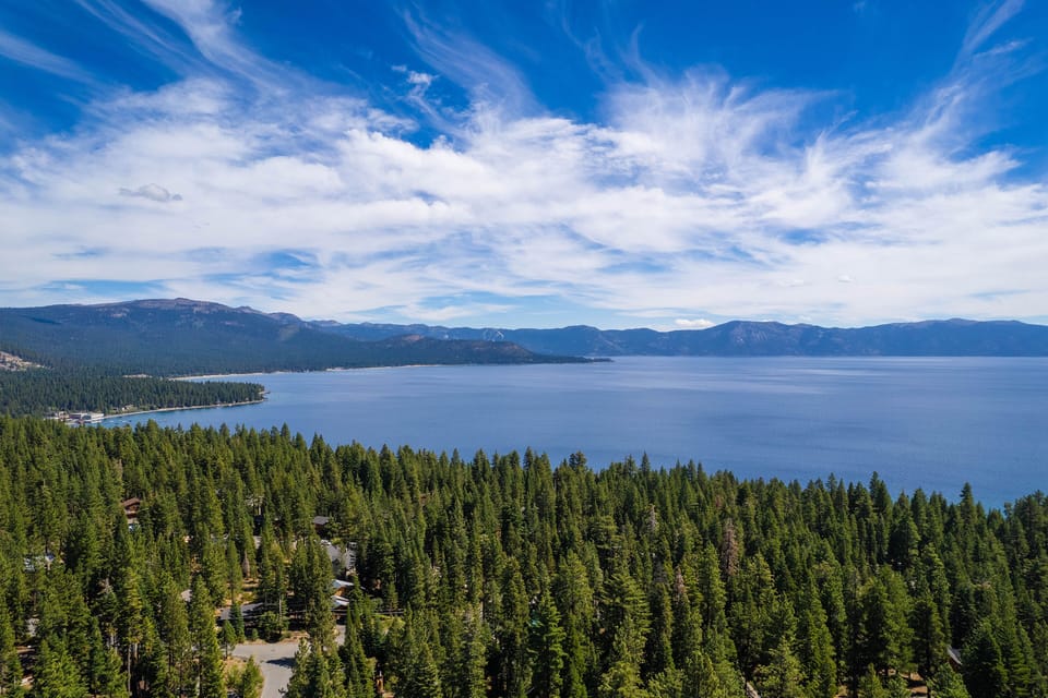 Douglas Exterior Aerial View of Lake from Home - Stunning lake & mountain views framed by endless forest scenery
